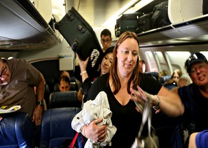 Airlines cash in on every inch, even that jammed bin overhead