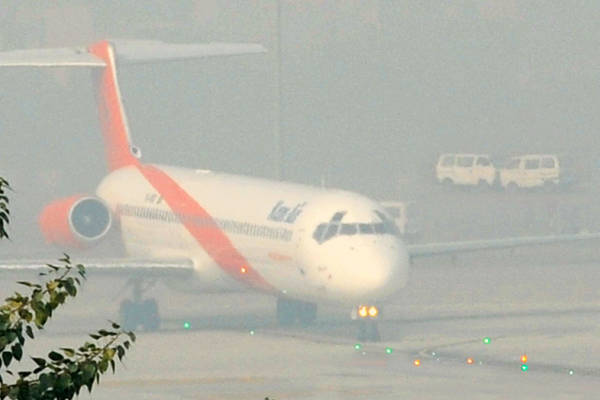 Dense fog cripples trains, flights